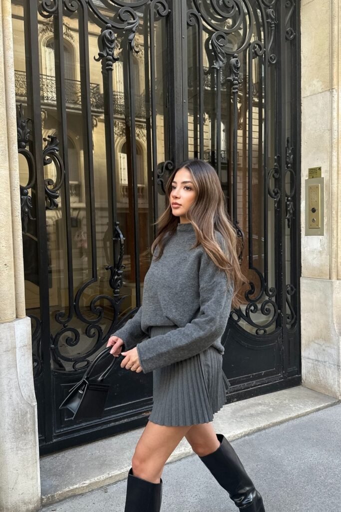 Grey Knit Sweater + Grey Pleated Mini Skirt + Black Knee Boots + Black Mini Structured Bag