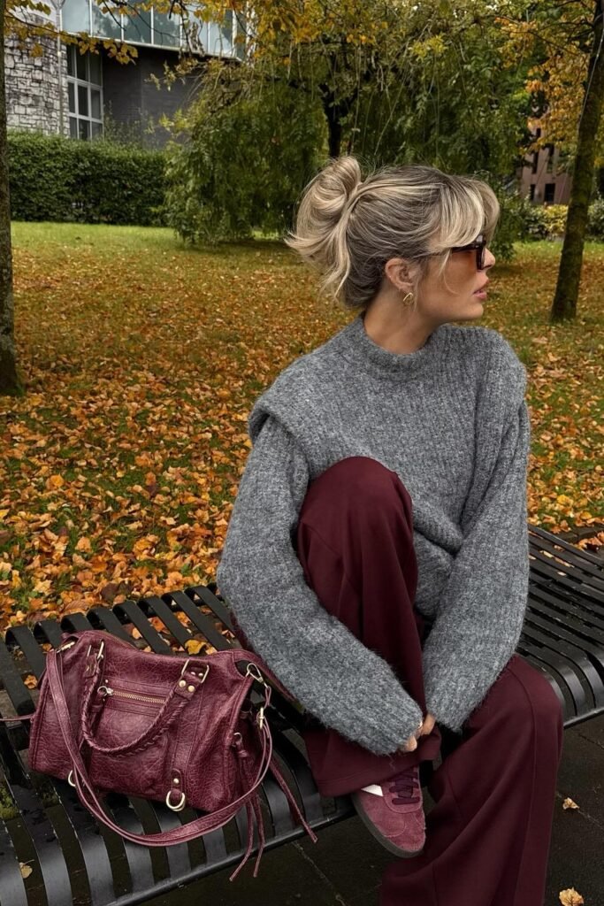 Grey Knit Sweater with Shoulder Detail + Burgundy Wide-Leg Trousers + Burgundy Sneakers + Burgundy Satchel Bag