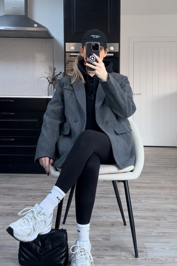 Grey Oversized Blazer + Black Hoodie + Black Leggings + White/Grey Sneakers + Black Cap