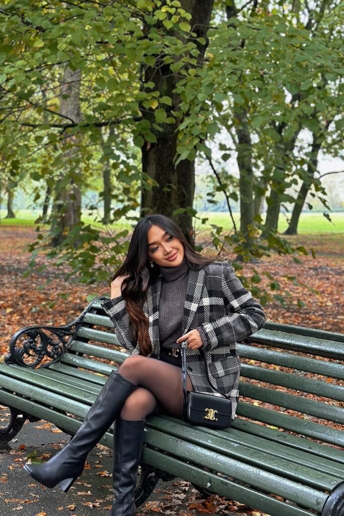 Grey Turtleneck Sweater + Black and White Plaid Blazer + Black Mini Skirt + Black Tights + Black Knee-High Boots + Black Shoulder Bag