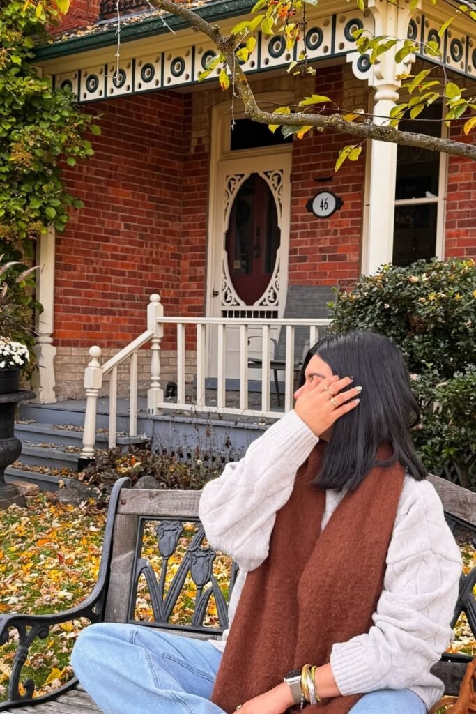 Light Grey Cable Knit Sweater + Light Wash Straight-Leg Jeans + Rust Brown Scarf