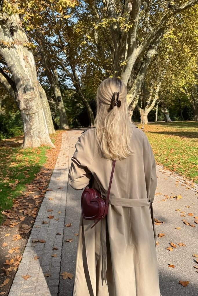 Long Beige Trench Coat + Brown Hair Claw Clip + Burgundy Heart-Shaped Bag