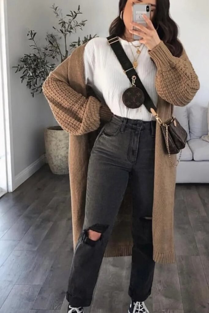 Long Taupe Cardigan + White Ribbed Top + Dark Washed Ripped Straight-Leg Jeans + White and Black Sneakers