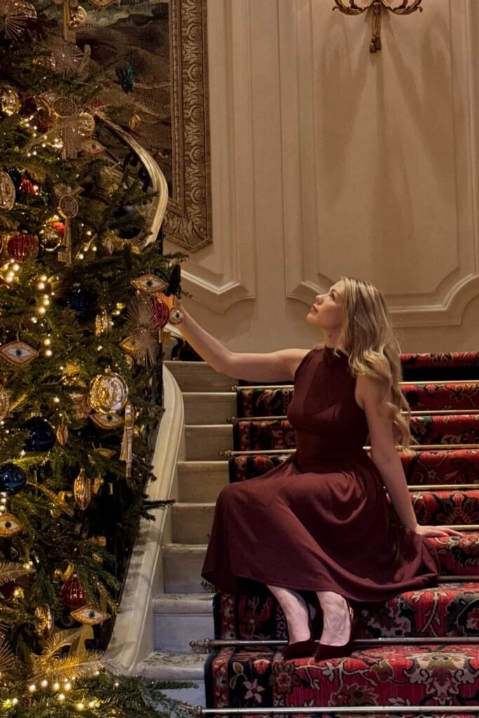 Merlot Sleeveless Midi Dress + Tonal Velvet Pumps + Red Carpeted Stairs