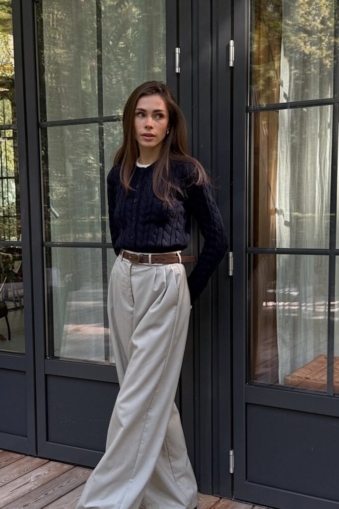 Navy Cable Knit Cardigan + White Blouse + Beige Wide-Leg Trousers + Brown Belt
