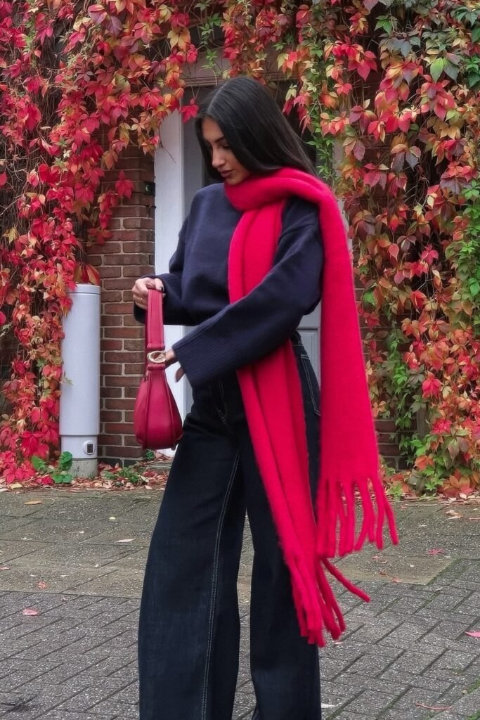 Navy Oversized Sweater + Hot Pink Chunky Scarf + Dark Wash Wide-Leg Jeans + Red Micro Bag