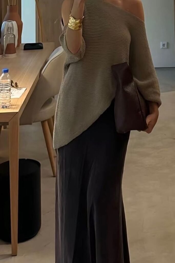 Off-Shoulder Taupe Knit Sweater + Black Satin Maxi Skirt + Gold Cuffs + Brown Clutch