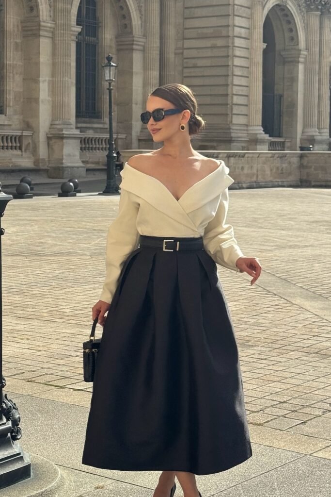 Off-White Off-Shoulder Top + Black Pleated Midi Skirt + Black Belt + Black Handbag