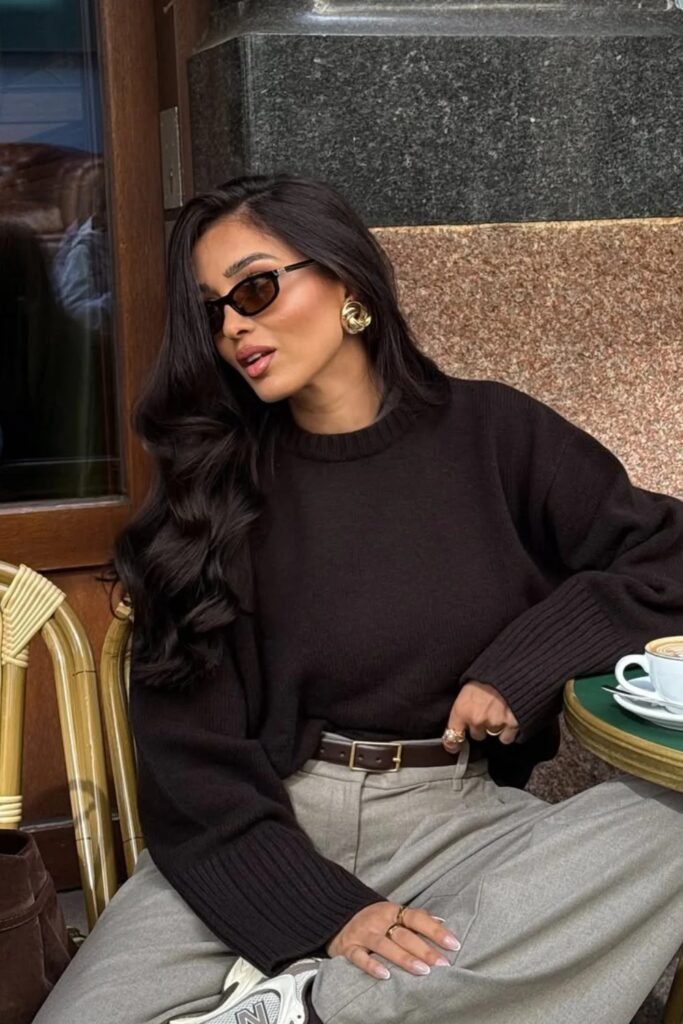 Oversized Black Knit Sweater + Brown Leather Belt + Grey Trousers + Gold Earrings