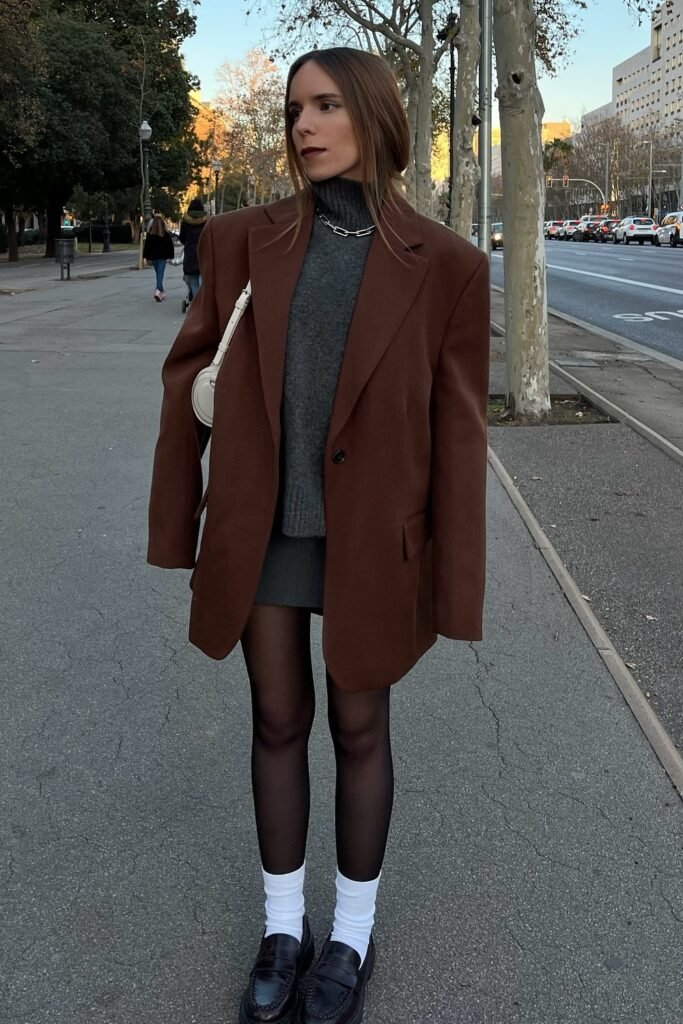 Oversized Brown Blazer + Grey Turtleneck Sweater + Dark Grey Mini Skirt + Black Tights + Black Loafers