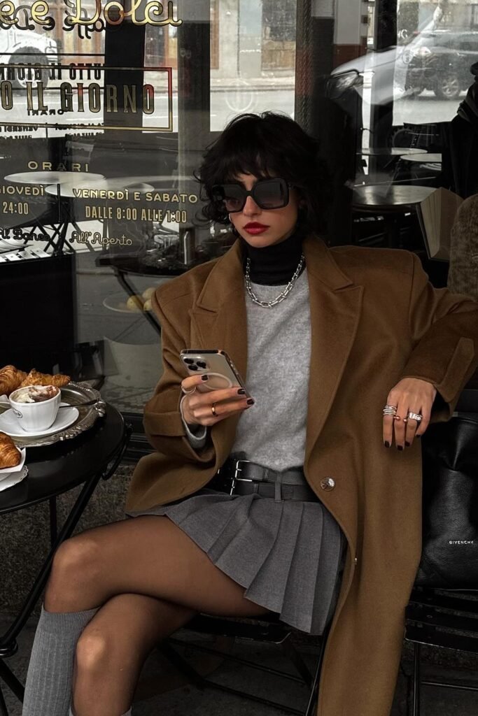 Oversized Brown Blazer + Light Grey Sweater Vest + Black Turtleneck + Grey Pleated Mini Skirt + Tights + Chunky Silver Chain