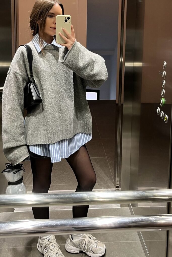 Oversized Grey Sweater + Light Blue Striped Collared Shirt + Black Mini Skirt + Black Tights + Grey/White Trainers