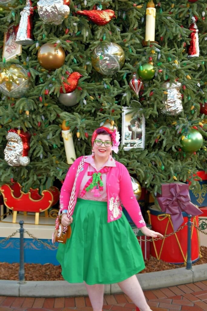 Pink Cardigan with Snowman Detail + Pink Gingham Shirt + Green Midi Skirt + Red Headband