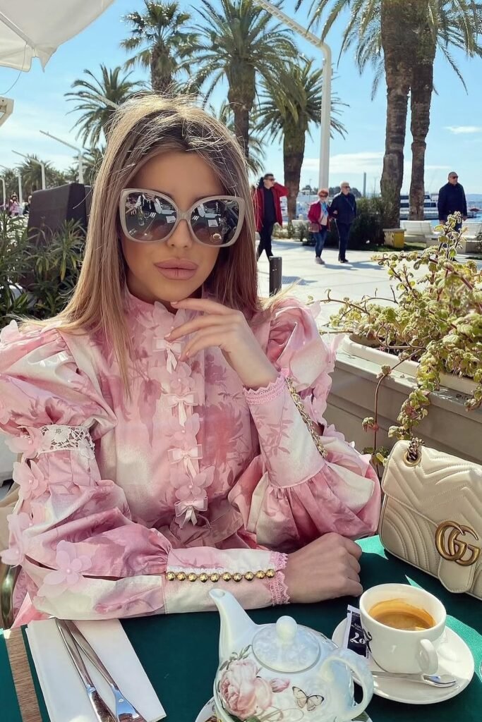 Pink Jacquard Ruffle Blouse + Grey Oversized Sunglasses + Cream Quilted Crossbody Bag