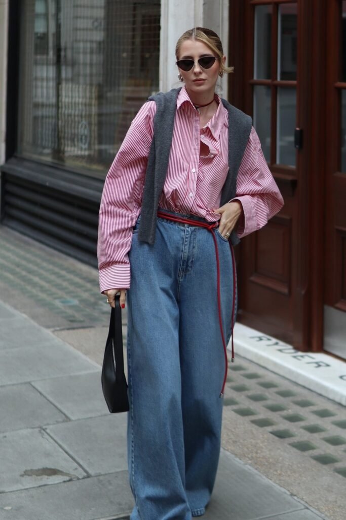 Pink Striped Oversized Shirt + Gray Vest Accent + Medium Wash Wide-Leg Jeans + Red Belt