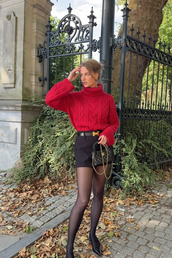 Red Cable Knit Sweater + Black Skirt + Black Heeled Boots + Black Crossbody Bag + Black Tights