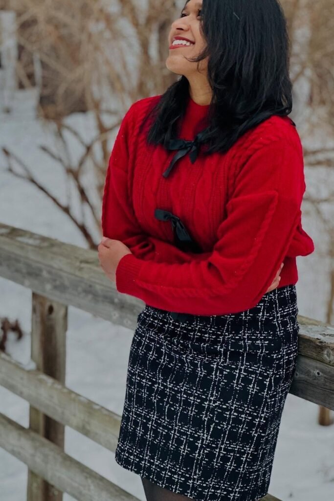 Red Cable-Knit Sweater + Black and White Tweed Mini Skirt + Black Tights