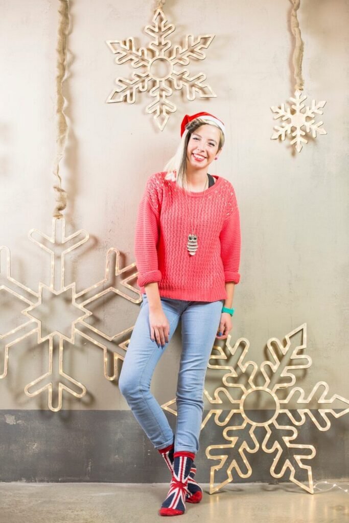 Red Knit Sweater + Light Wash Skinny Jeans + Union Jack Pattern Socks + Santa Hat