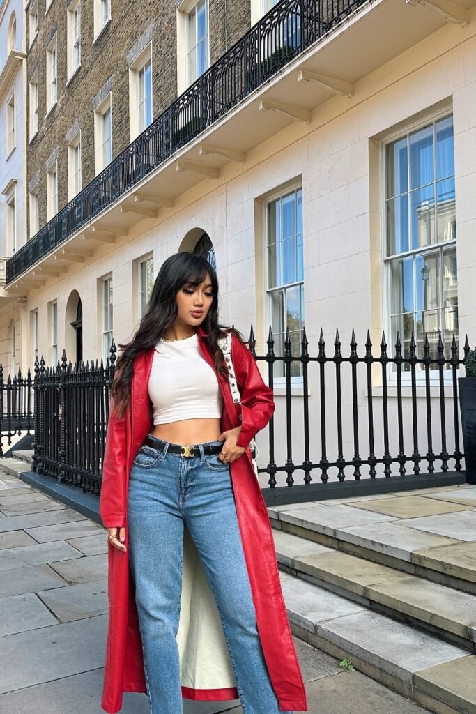 Red Leather Trench Coat + White Cropped Top + Blue Straight-Leg Jeans + Black Belt + White Handbag