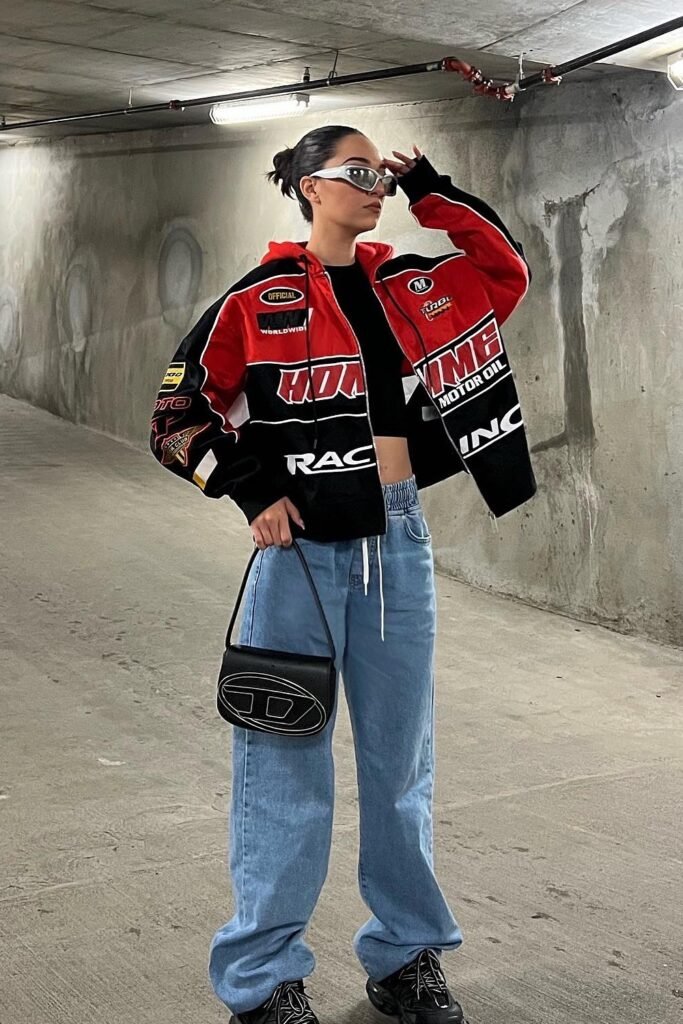 Red and Black Racing Jacket + Light Blue Baggy Jeans + Black Chunky Sneakers