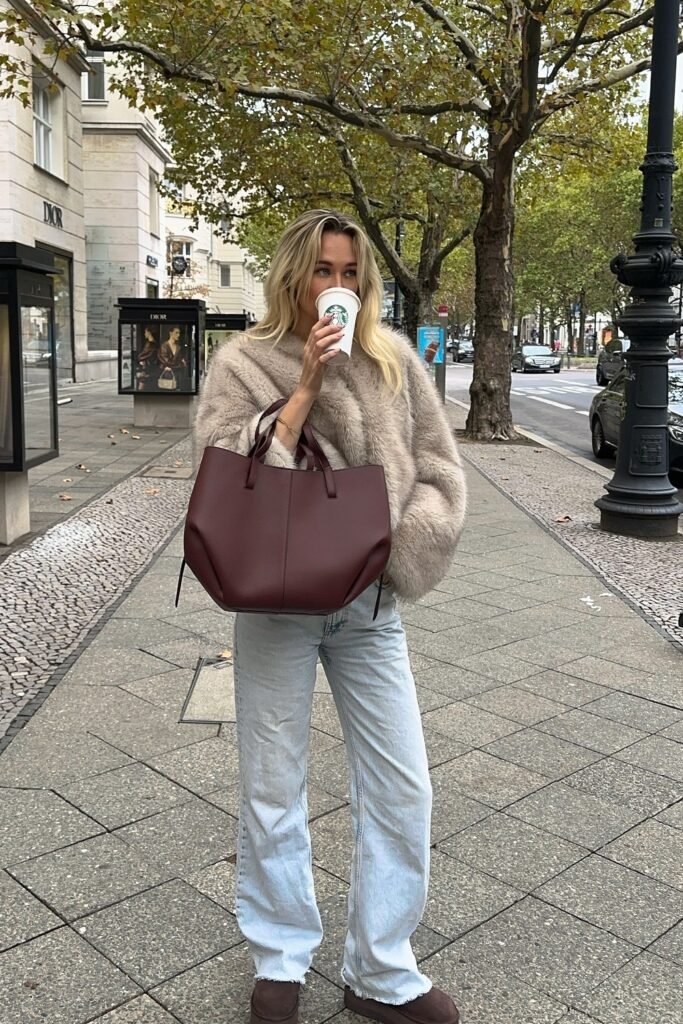 Tan Fluffy Faux Fur Sweater + Light Wash Wide-Leg Jeans + Dark Burgundy Leather Tote Bag + Dark Brown Suede Boots