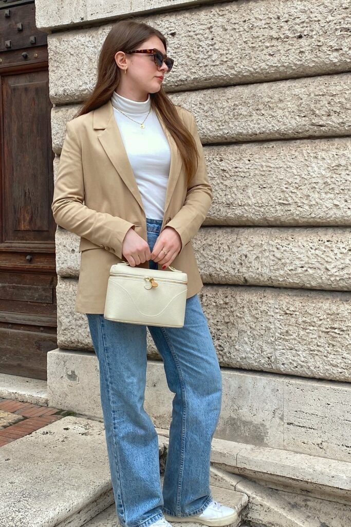 Tan Oversized Blazer + White Turtleneck Top + Light Wash Wide-Leg Trousers + White Sneakers