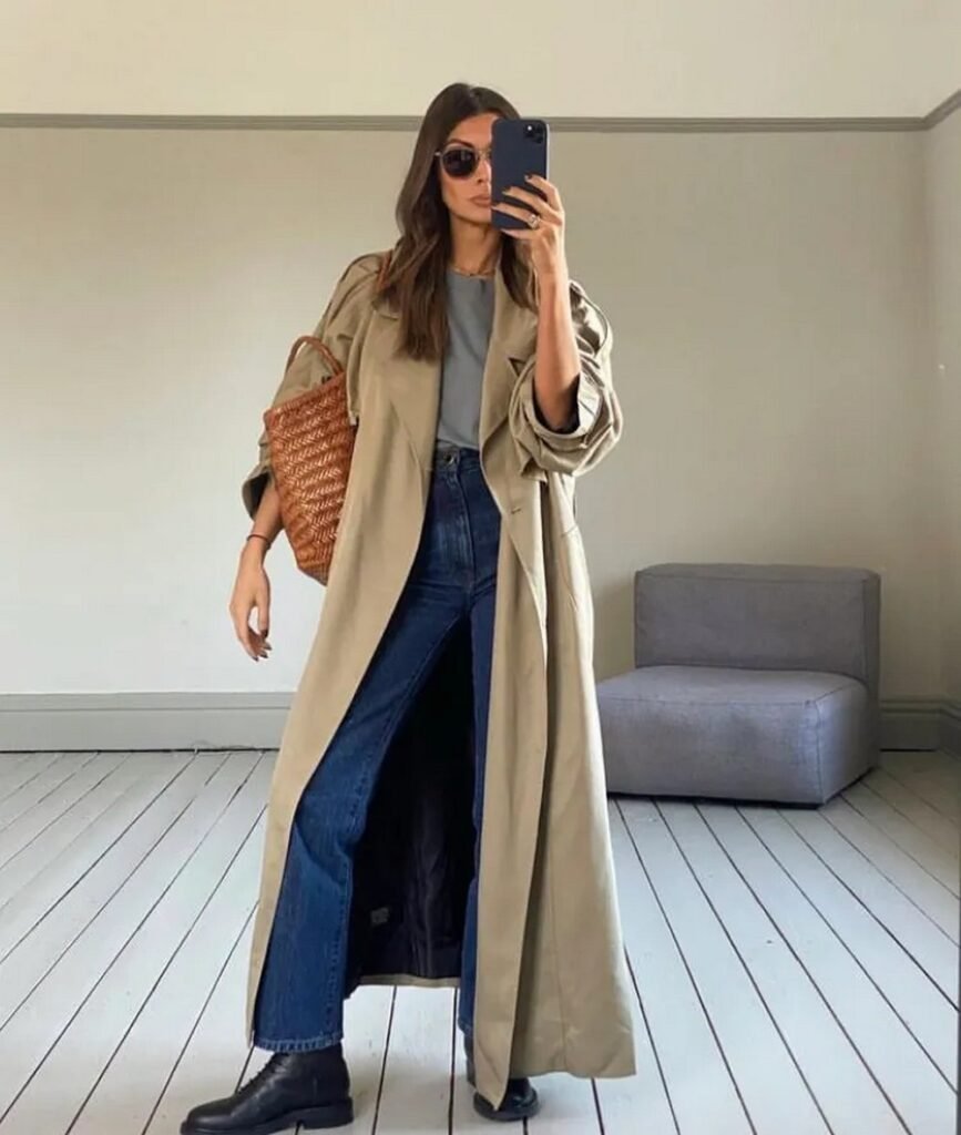 Tan Trench Coat + Grey T-Shirt + Dark Wash Straight Leg Jeans + Black Lace-Up Boots + Woven Basket Bag