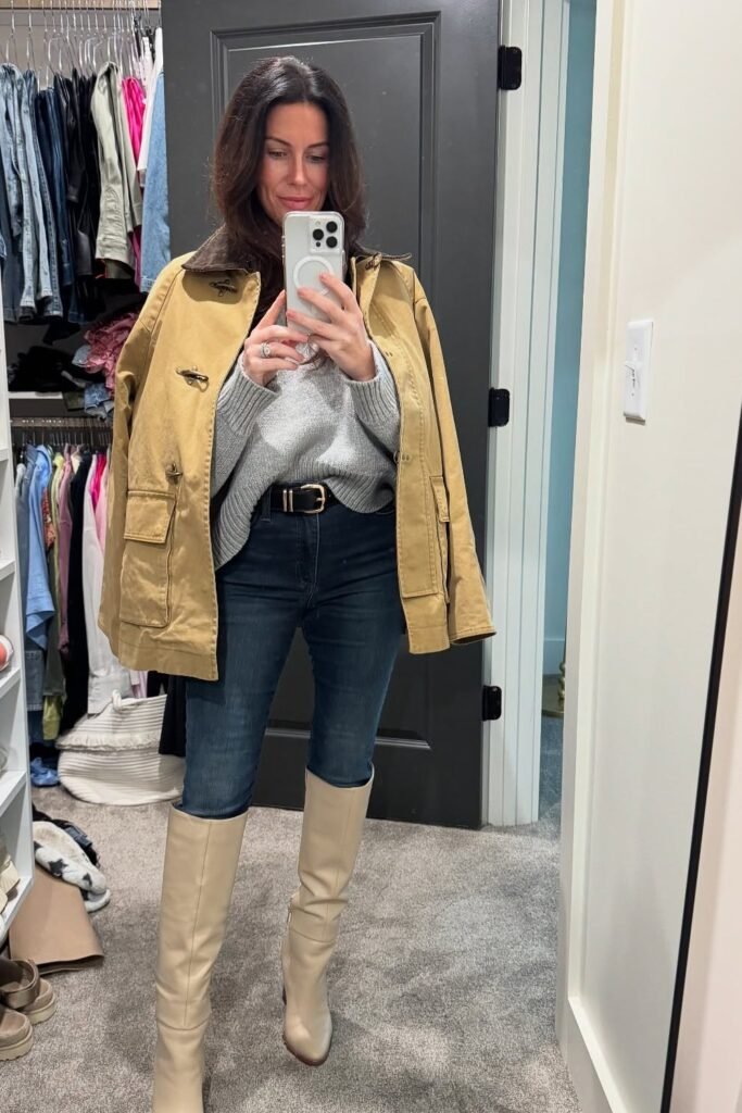 Tan Utility Jacket + Grey Knit Sweater + Dark Blue Skinny Jeans + Cream Knee-High Boots