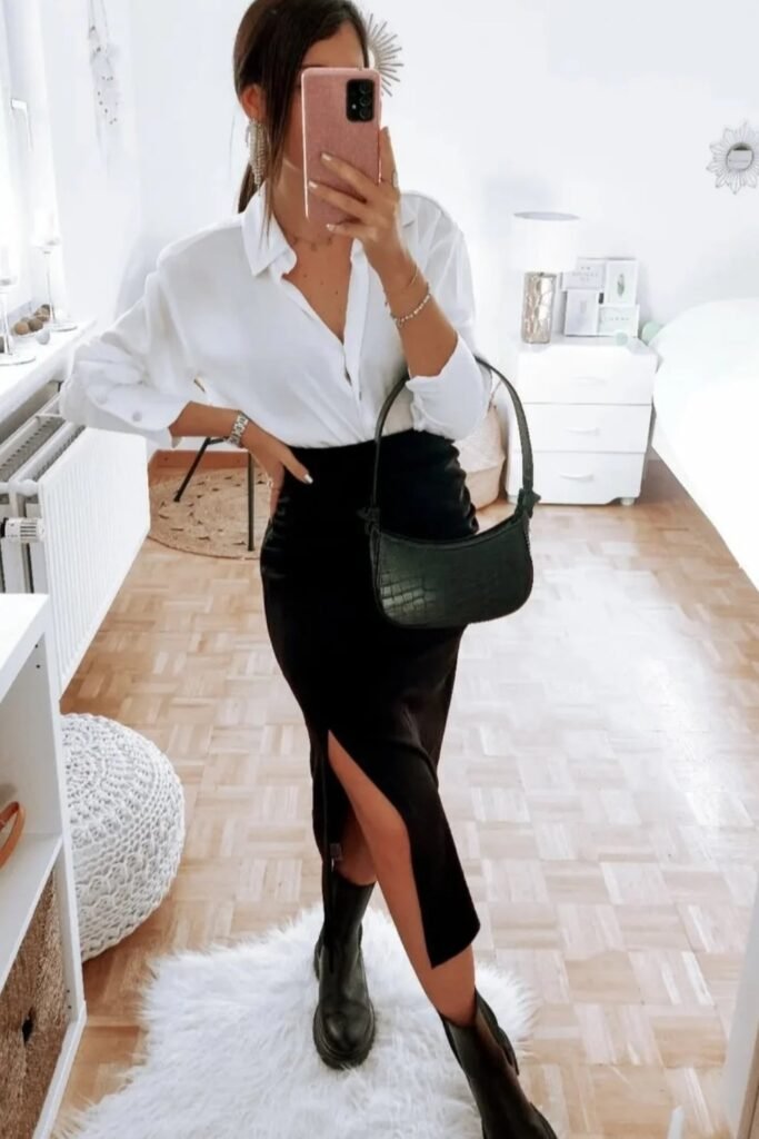 White Button-Up Shirt + Black Midi Skirt with Slit + Black Boots + Black Shoulder Bag