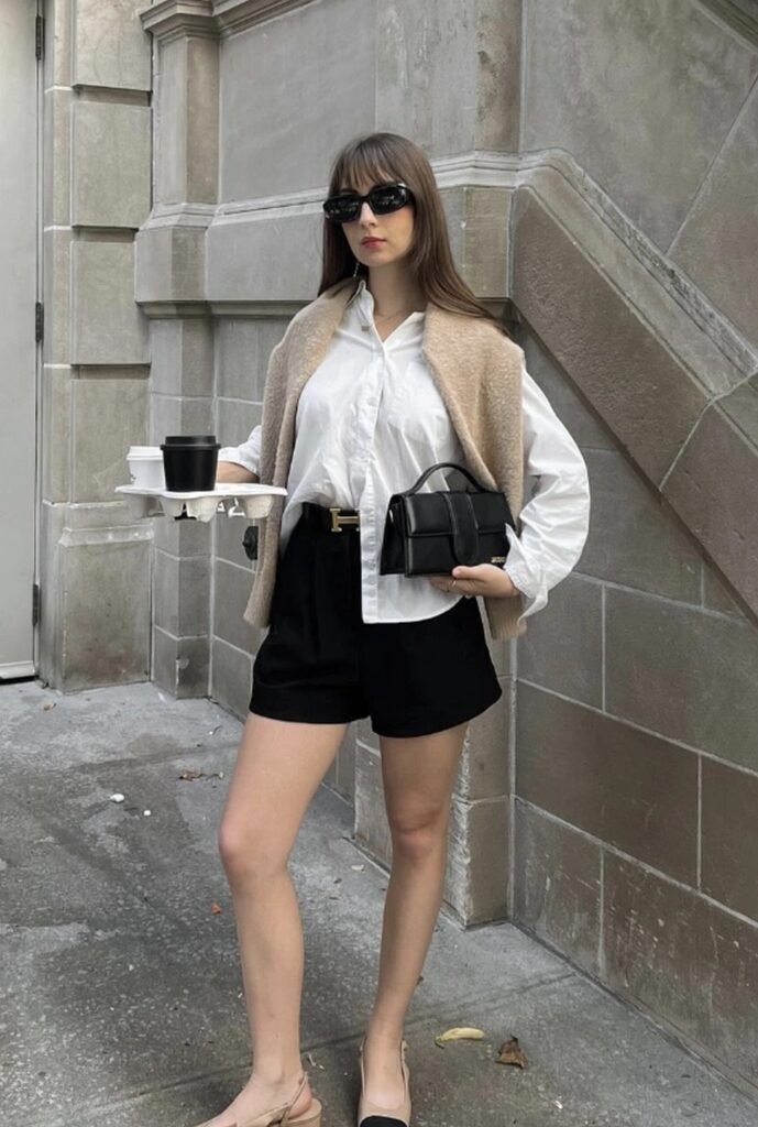 White Button-Up Shirt + Cozy Beige Vest + Tailored Black Shorts