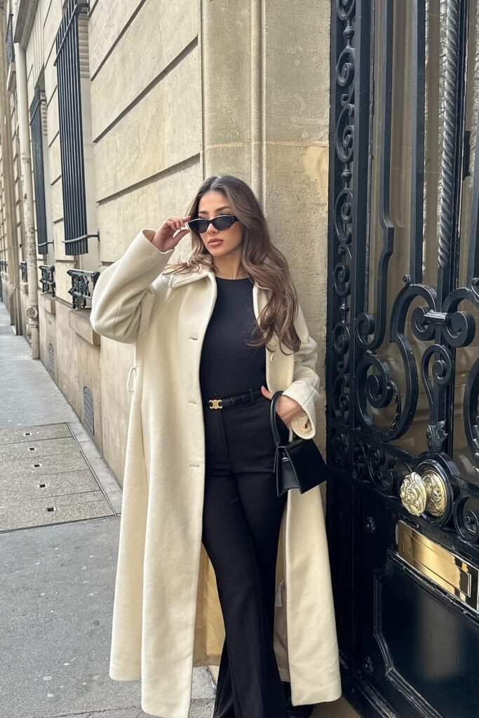 White Long Coat + Black Top + Black Flared Pants + Black Structured Bag + Black Sunglasses