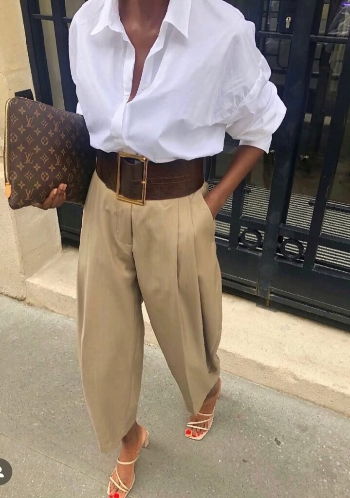 White Oversized Shirt + Tan Baggy Trousers + Wide Brown Belt + Strappy Nude Heels