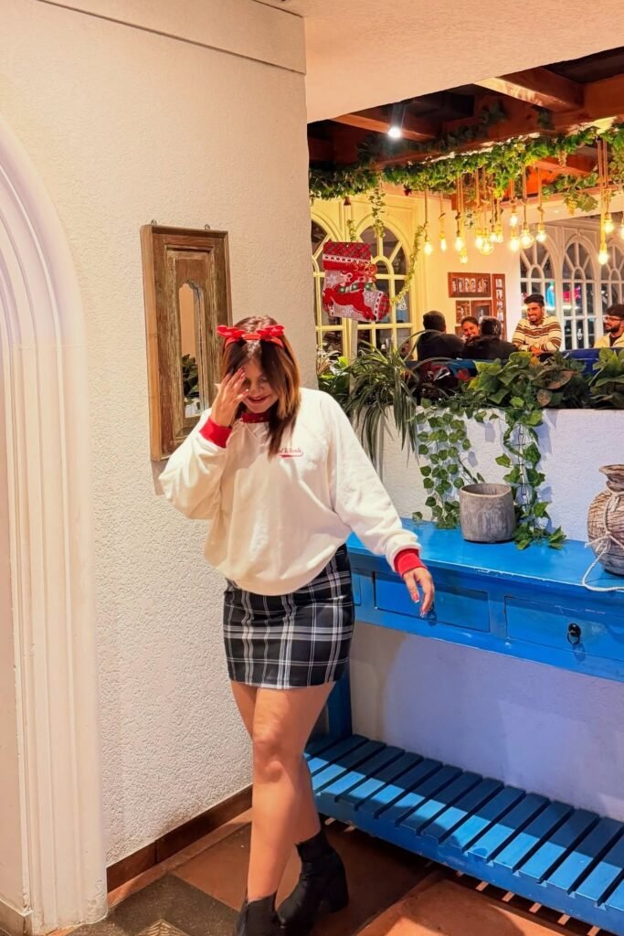 White Oversized Sweatshirt with Red Trim + Black Plaid Mini Skirt + Black Ankle Boots