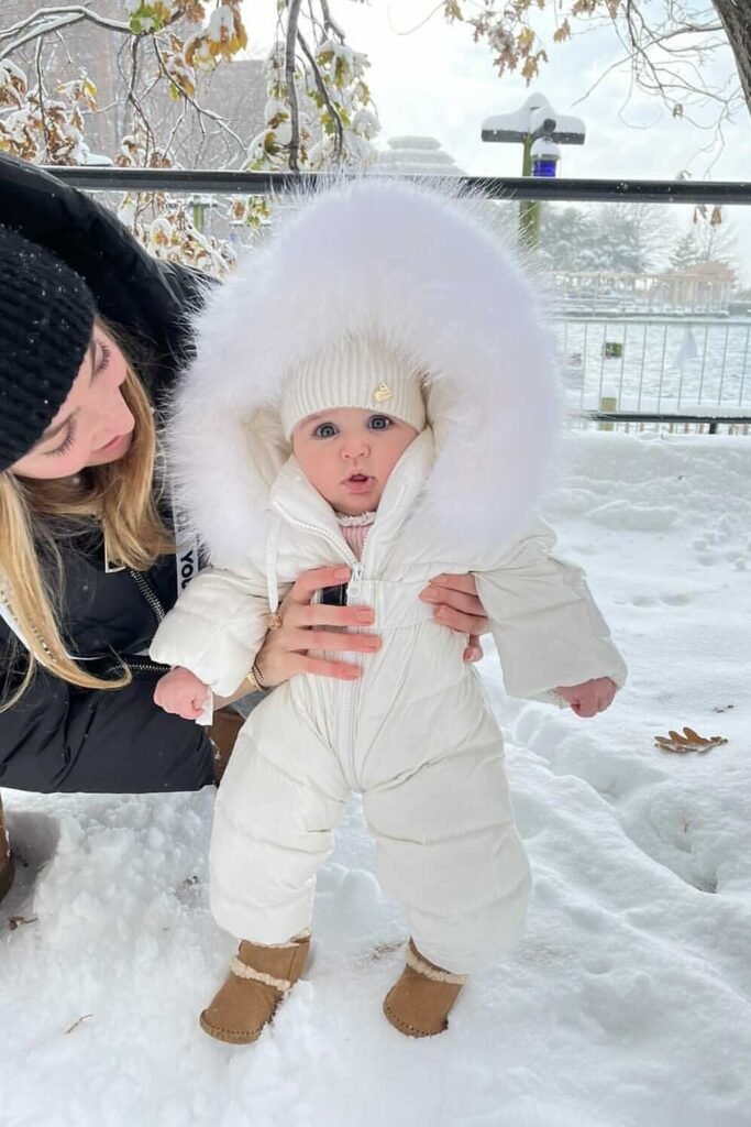White Puffer Snowsuit + White Pom-Pom Beanie + Brown Boots