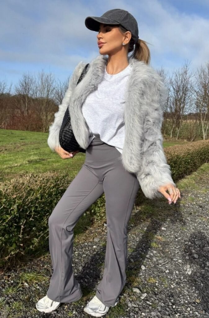 White T-shirt + Grey Fur Jacket + Grey Flared Pants + White Sneakers + Black Cap