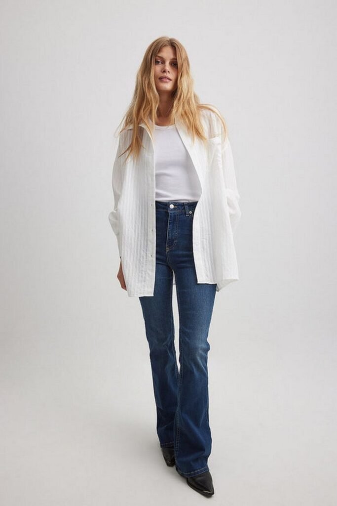 White T-shirt + White Oversized Button-Down Shirt + Dark Blue Flared Jeans + Black Pointed Heels
