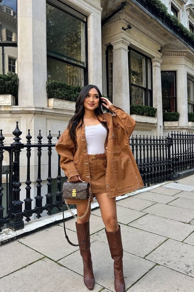 White Tank Top + Brown Mini Skirt + Brown Oversized Shirt Jacket + Brown Knee-High Boots + Brown Crossbody Bag