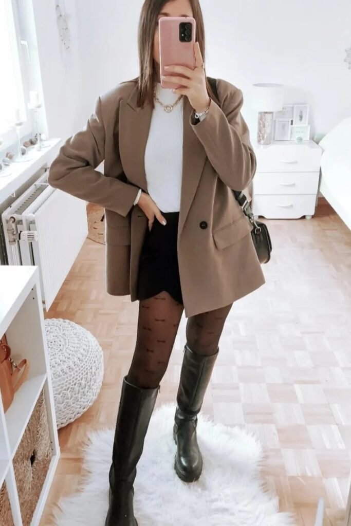 White Top + Black Mini Skirt + Brown Oversized Blazer + Patterned Black Tights + Black Knee-High Boots