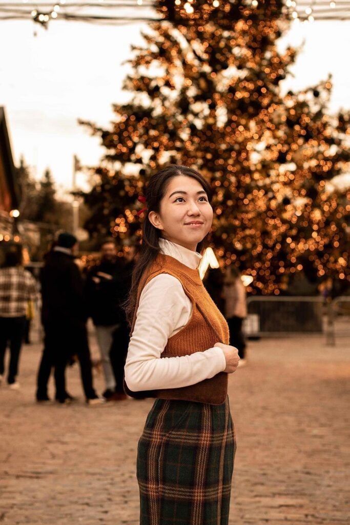 White Turtleneck + Rust Knit Vest + Plaid Midi Skirt