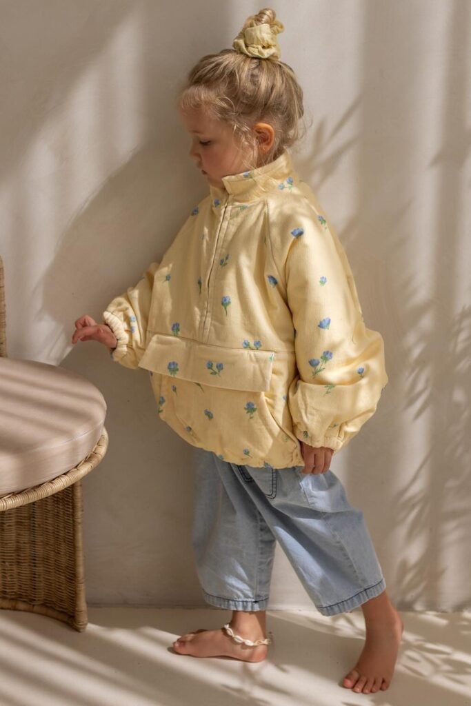 Yellow Floral Pullover + Light Denim Pants + Barefoot + Hair in Bun