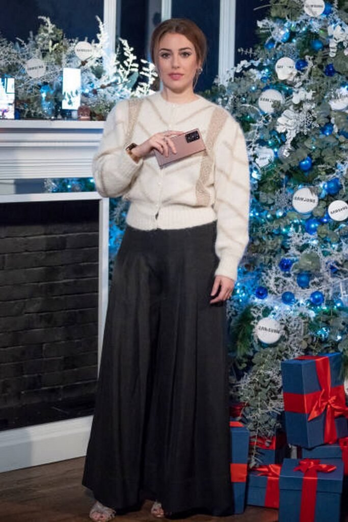 Cream Cardigan with Gold Detail and Black Wide-Leg Skirt/Pants