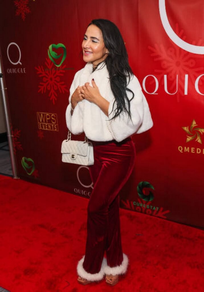 White Faux Fur Bolero with Burgundy Velvet Trousers with Fur-Trimmed Cuffs and White Chanel Bag