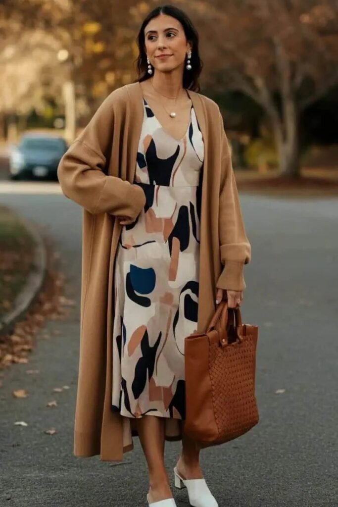 Abstract Print V-Neck Midi Dress + Oversized Camel Cardigan + White Block-Heel Mules + Brown Woven Tote