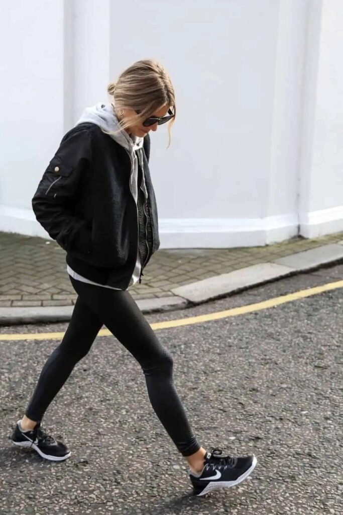 Black Bomber Jacket + Grey Hoodie + Black Leggings + Black Sneakers