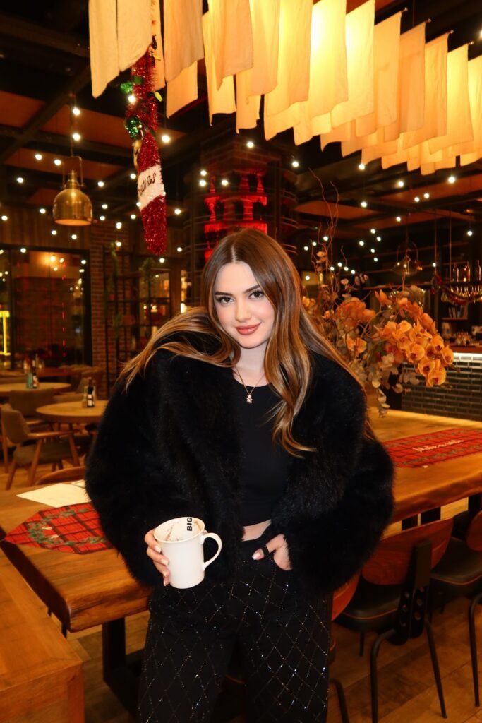 Black Cropped Top + Black Diamond-Patterned Trousers + Oversized Black Faux Fur Coat