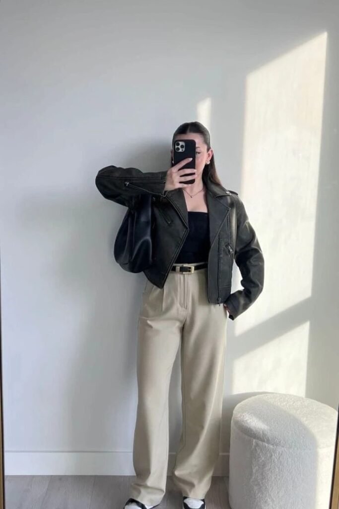 Black Leather Biker Jacket + Black Tube Top + Beige High-waisted Trousers + Black and White Sneakers