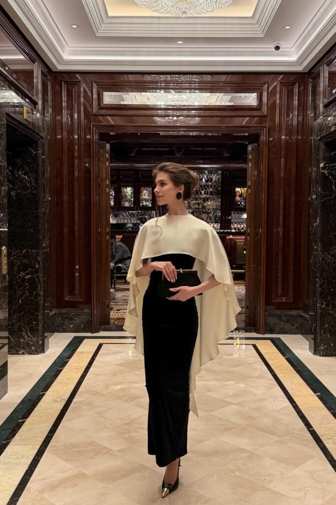 Black Strapless Column Dress + Cream Structured Capelet + Black and Gold Pointed-Toe Heels