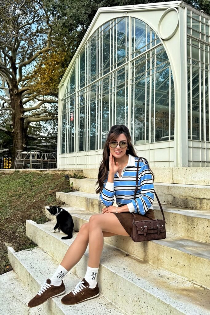 Blue Striped Polo + Brown Mini Skirt + Brown Low-Top Sneakers