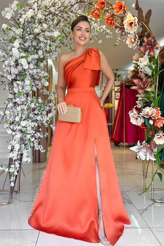 Burnt Orange One-Shoulder Satin Gown + Bow Detail + Gold Woven Clutch