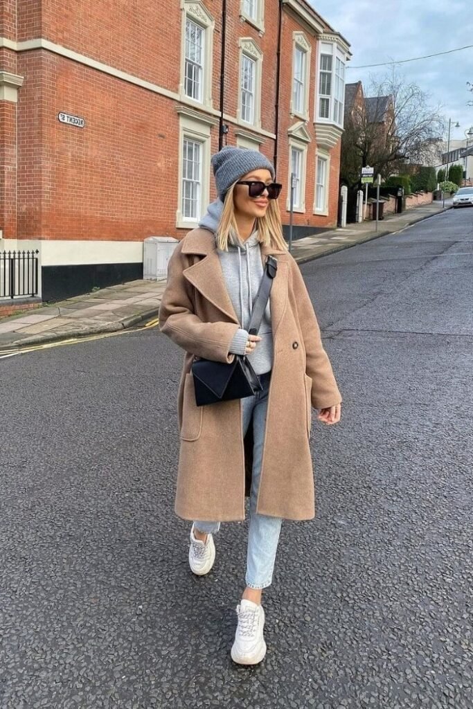 Camel Overcoat + Grey Hoodie + Light Wash Jeans + White Sneakers